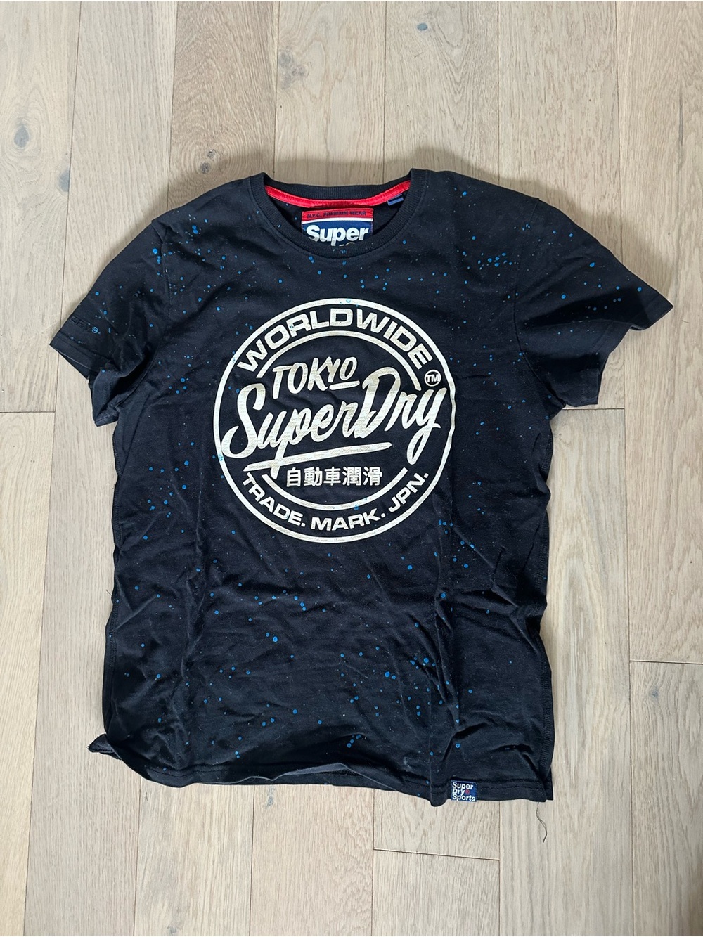 Superdry Black Tee with White Tokyo Emblem and Blue Speckle